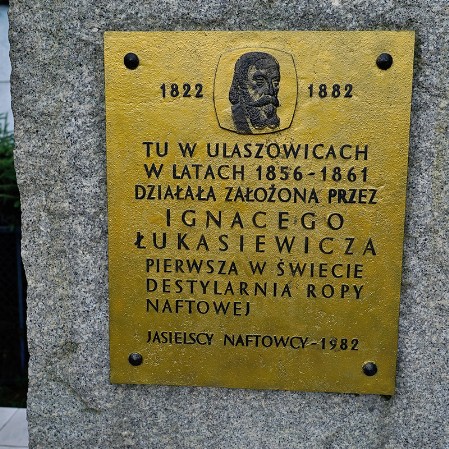 An obelisk with a plaque commemorating the founding of the world's first crude oil distillery in Ulaszowice by Ignacy Łukasiewicz..2